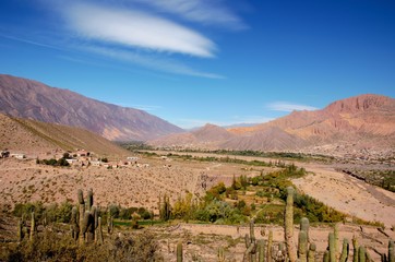 Long shot of the seven color hill or cerro de los siete colores in the village Purmamarca in the canyon quebrada de humahuaca in Jujuy, Argentina, South America