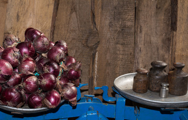 Bow to weigh on the old scale, spices, food for sale, small business, agriculture,