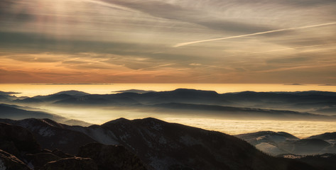 Obraz na płótnie Canvas Mountain panorama - inversion and colorful sky