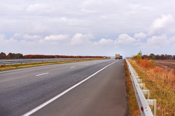 road stretches into the distance to the horizon. Beautiful sky with clouds beautiful. Natural background.
