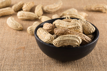 Closeup boiled peanuts in black cup, street food of Thailand.