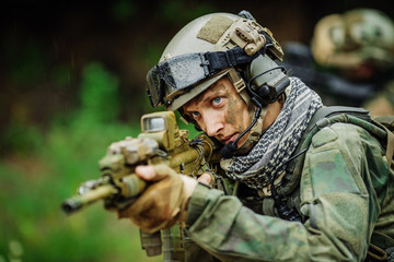 Portrait of a ranger in the battlefield with a gun