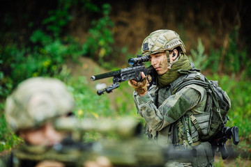 Portrait of a ranger in the battlefield with a gun