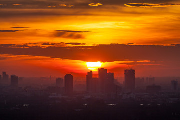 Beautiful sunrise over office building center of Bangkok in Thai