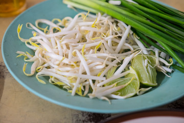 Bean Sprouts and lemon eating with Pad Thai