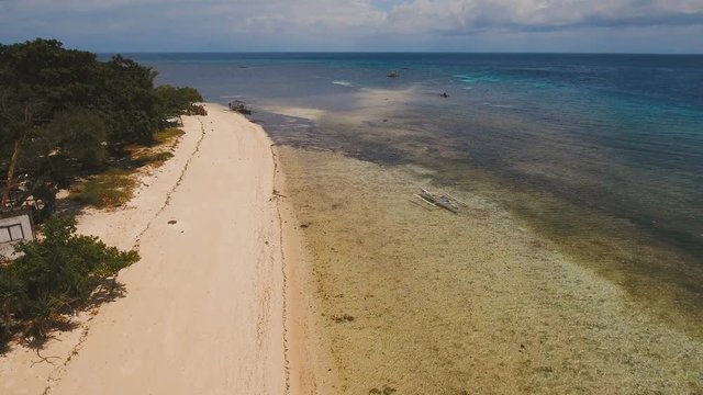 Aerial view of beautiful tropical island Mantigue with white sand beach. Beautiful , sea, resort. Seascape: Ocean and beautiful beach paradise. View of a nice tropical beach from the air. Philippines