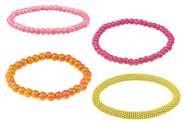 Set of three elastic bracelets made of pearl-like round beads (pink, purple and orange) and one yellow metallic elastic bracelet, isolated on white background, clipping path included
