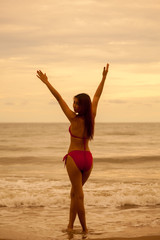 Fototapeta na wymiar Young beautiful asian woman posing at beach