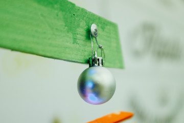 Fototapeta na wymiar Christmas and New Year's decoration in the form of silver sphere.