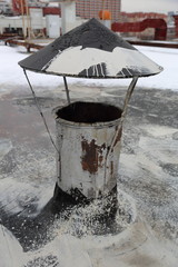 The pipe for the steam and hot air on the roof of an industrial building