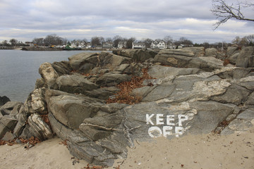 'Keep off rocks' sign at beach