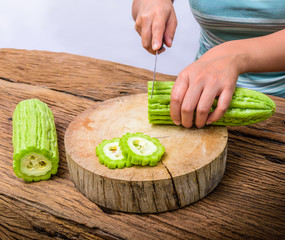 Woman is chopped a bitter Gourd