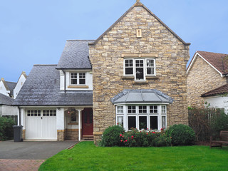 well maintained older English suburban house with slate roof