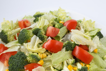 Fresh vegetable on a white plate. Healthy vegetarian food