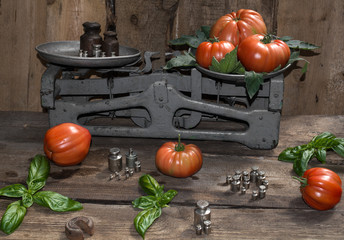 Tomatoes red to weigh on the old scale, ripe tomatoes, food for sale, small business, agriculture,