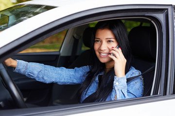 Woman sitting in the car and calling