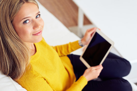 Portrait of beautiful woman with digital tablet