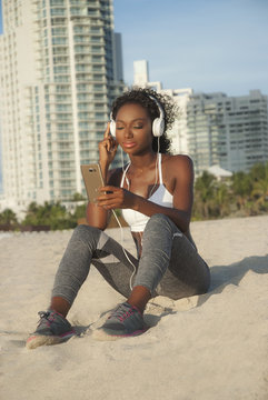 Sexy brown skin woman with headphones