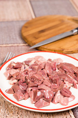 Sliced raw chicken liver on the plate