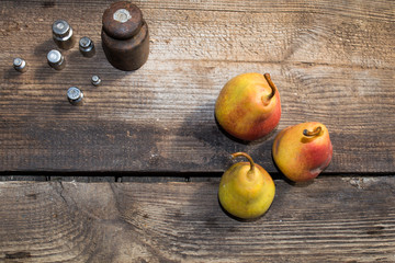 Yellow pears on old table, ripe pears, food for sale, small business, agriculture,