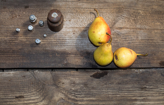 Yellow pears on old table, ripe pears, food for sale, small business, agriculture,