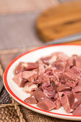 Closeup macro sliced chicken liver on the plate
