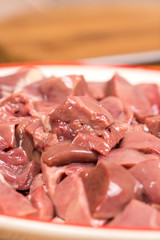 Closeup macro sliced chicken liver on the plate