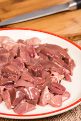Closeup macro sliced chicken liver on the plate