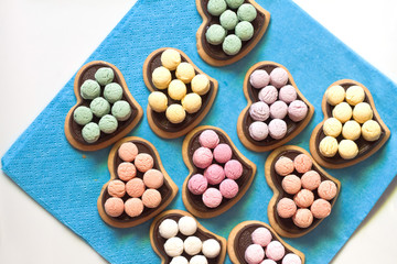 Heart-shaped chocolate cookies with sugar candy
