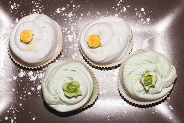 cupcake of baby clothes white and green
