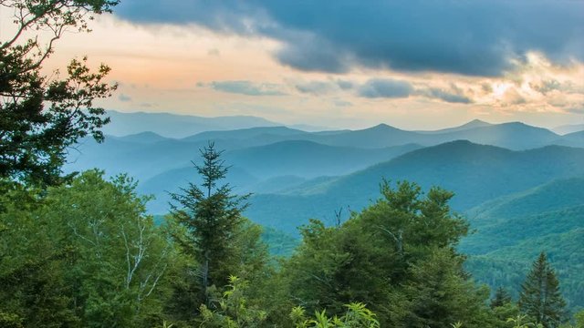 Caney Fork Overlook on the Blue Ridge Parkway at Sunset over the Smoky Mountains near Asheville, North Carolina with layers of the Appalachian Mountains and a Golden Colored Sky