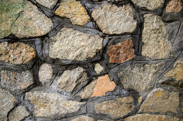 Texture of granite stone wall as a background