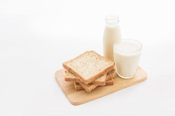 Fototapeta na wymiar glass of milk and whole wheat bread