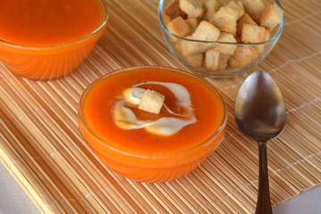 Pumpkin Creme Soup On A Bowl With Heavy Cream. Organic food.