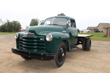 old red farm truck and green farm truck