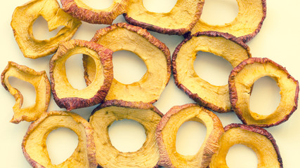 Dry fruits. Slices of dried apples. Storing vitamins for the winter and spring period. Healthy food. Decorative nature background.