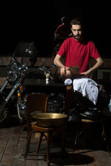 Barber shaves beard to man