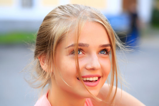 Blonde Girl In Pink Shirt