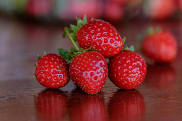 Fresh strawberries on old table wood