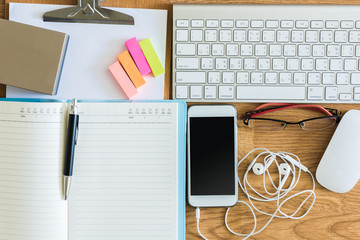 office table with clipboard, notepad, computer keyboard and mous