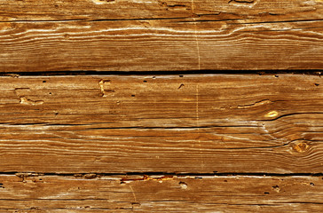 Orange weathered log house surface.