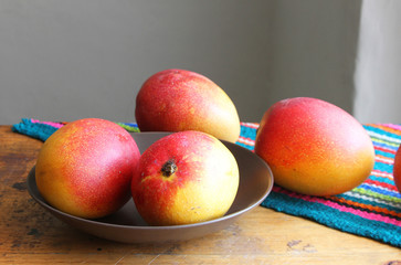 Whole Mangos on a Table