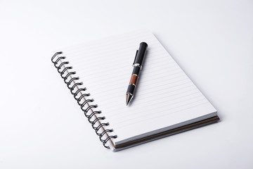 Clear paper and pen on white background.