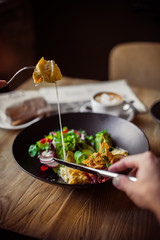 Breakfast table, man eating breakfast and drink coffee, close up