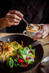 Breakfast table, man eating breakfast and drink coffee, close up