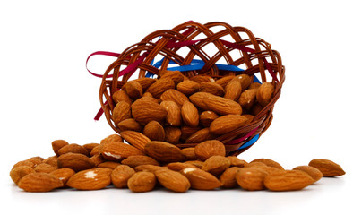 Almonds with basket on white background