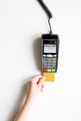 payment terminal with card on white background top view