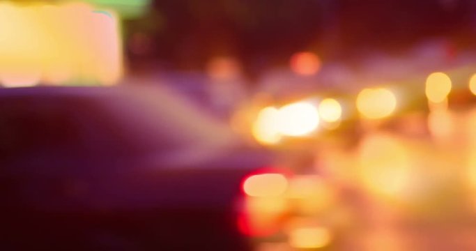 Defocused cars in city night.