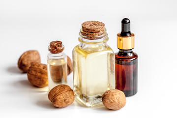 cosmetic and therapeutic walnut oil on white background