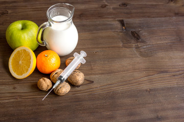 concept food allergies on wooden background